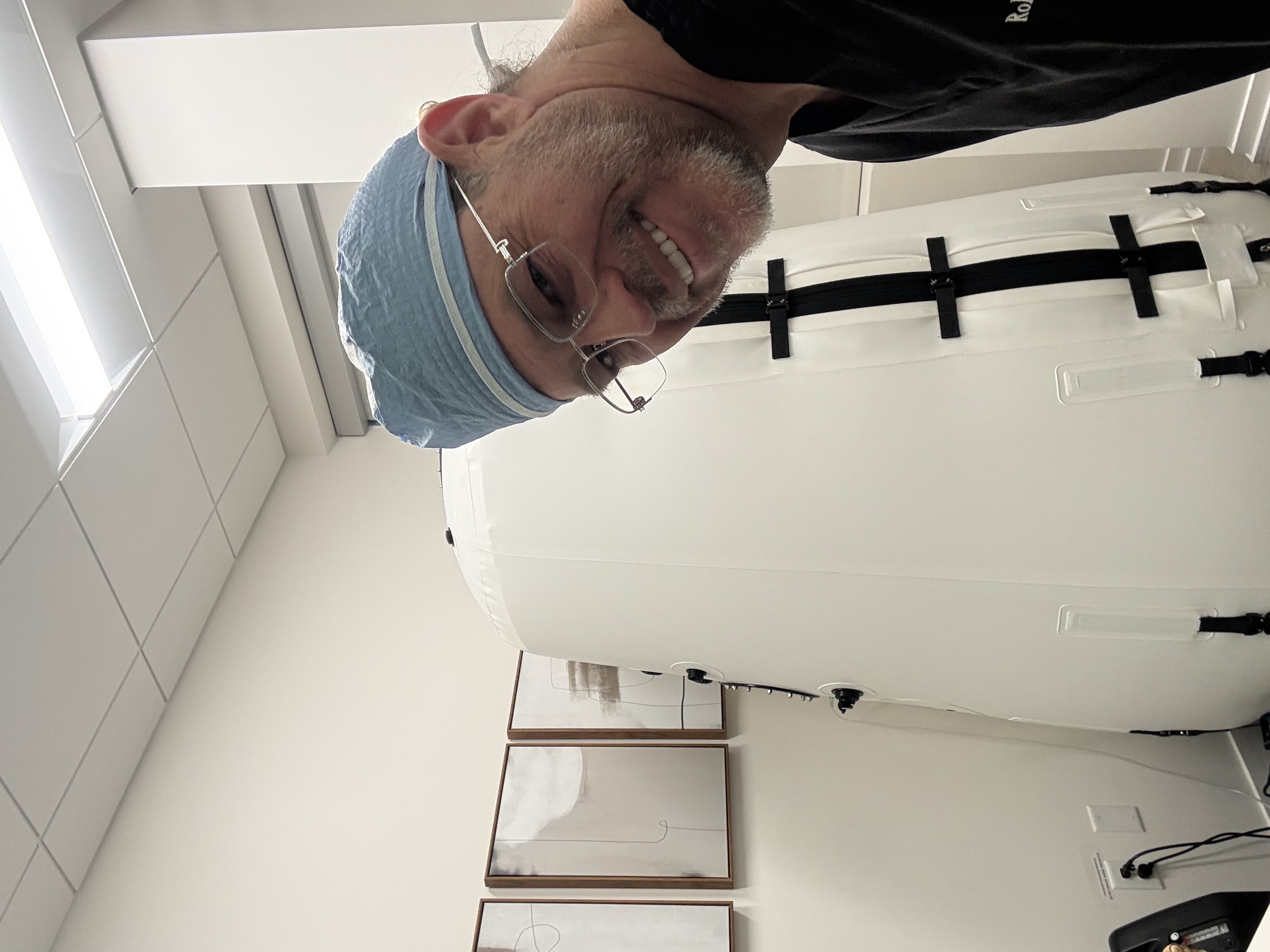 Dr. Robert Whitfield in surgical scrubs