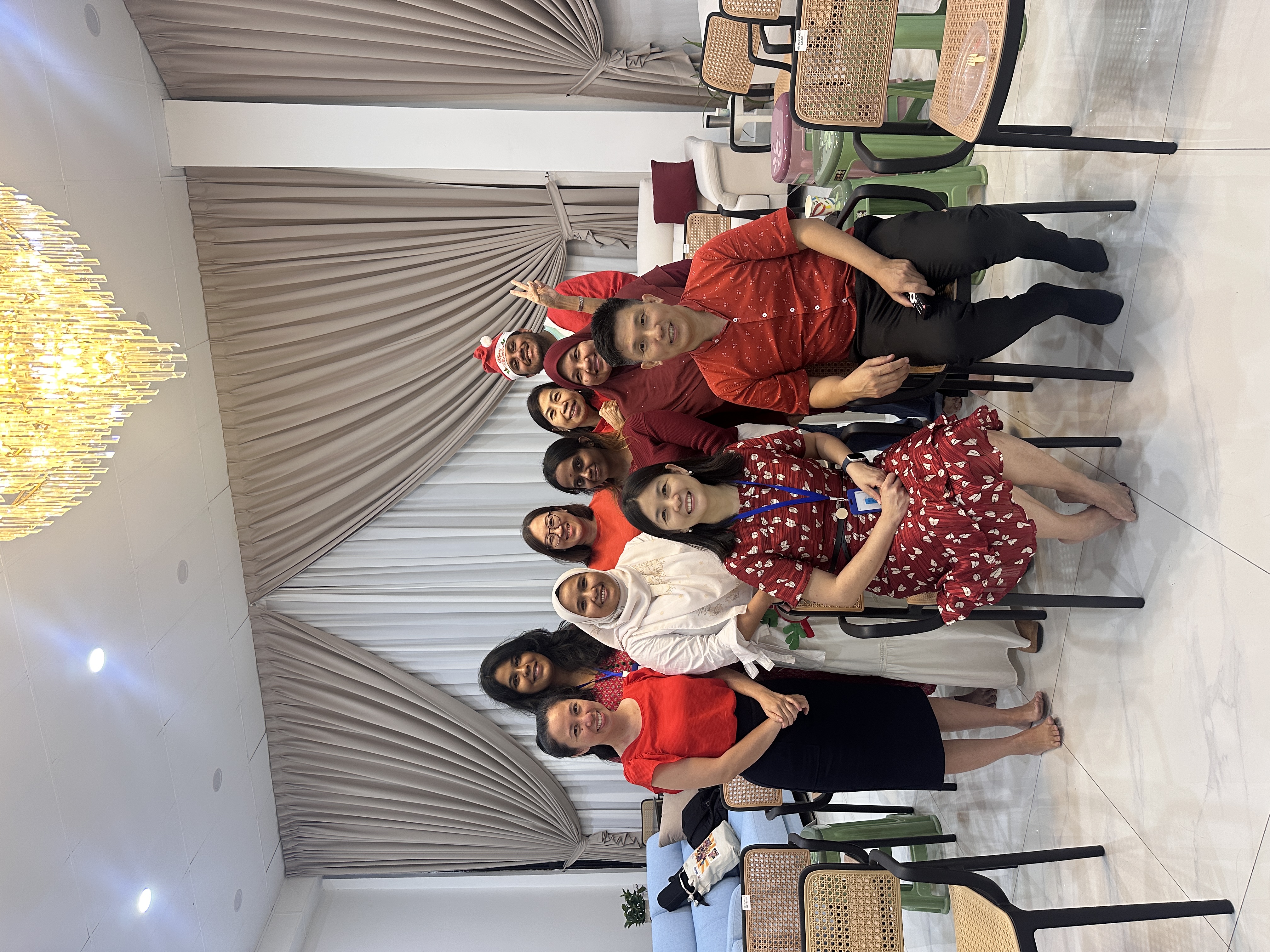 Gift presentation during the Christmas celebration at AIM Healthcare Centre