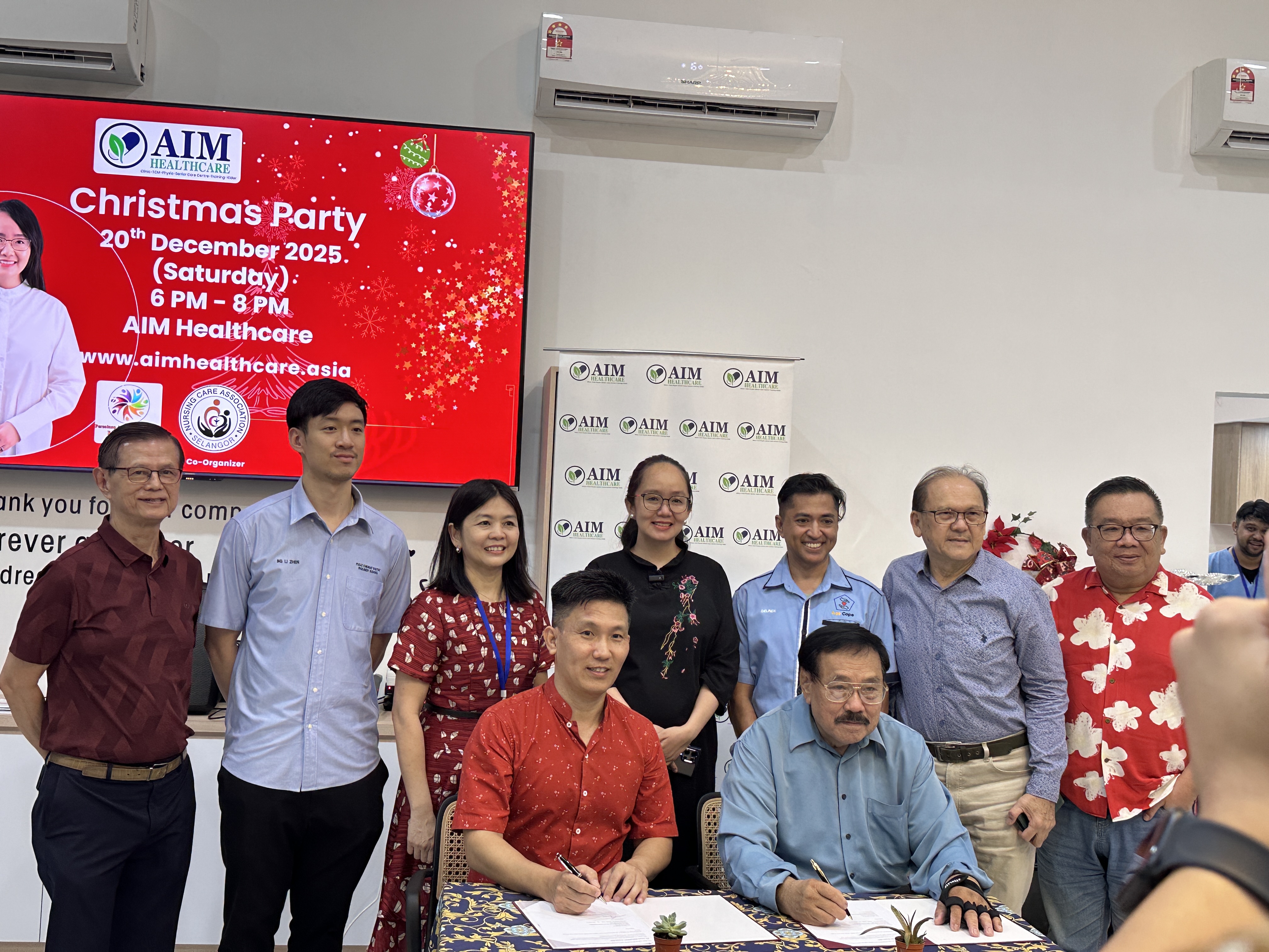 Birthday celebration with YB Michelle Ng and community members cutting cakes