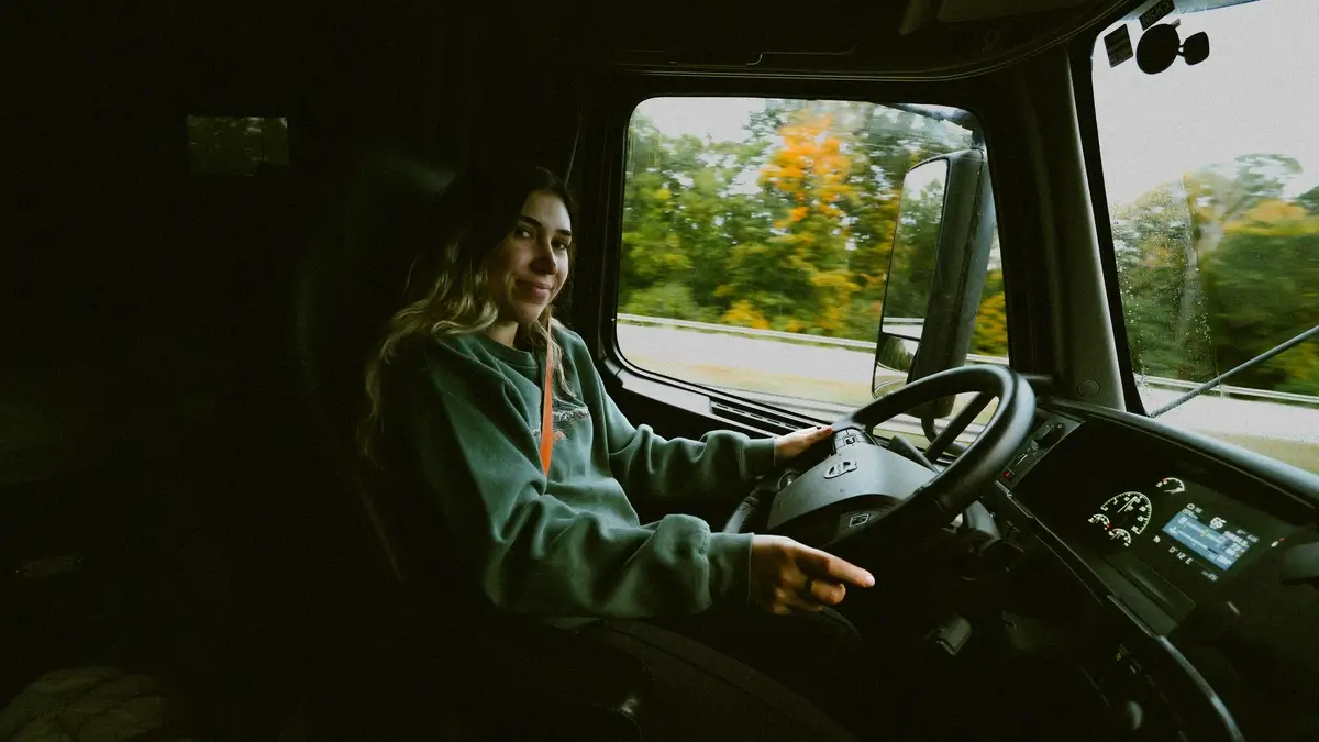 Victoria behind the wheel of her heavy-duty truck